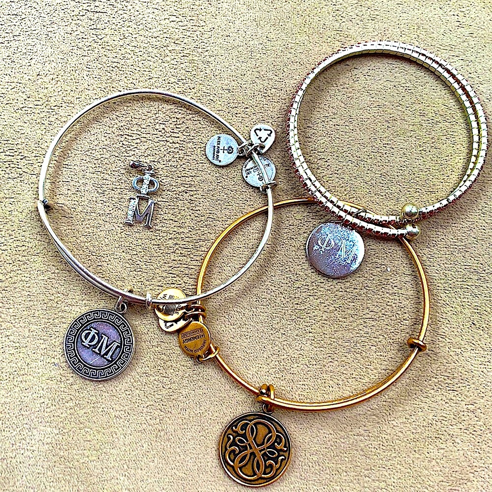 3 phi mu sorority bracelets and pendant.